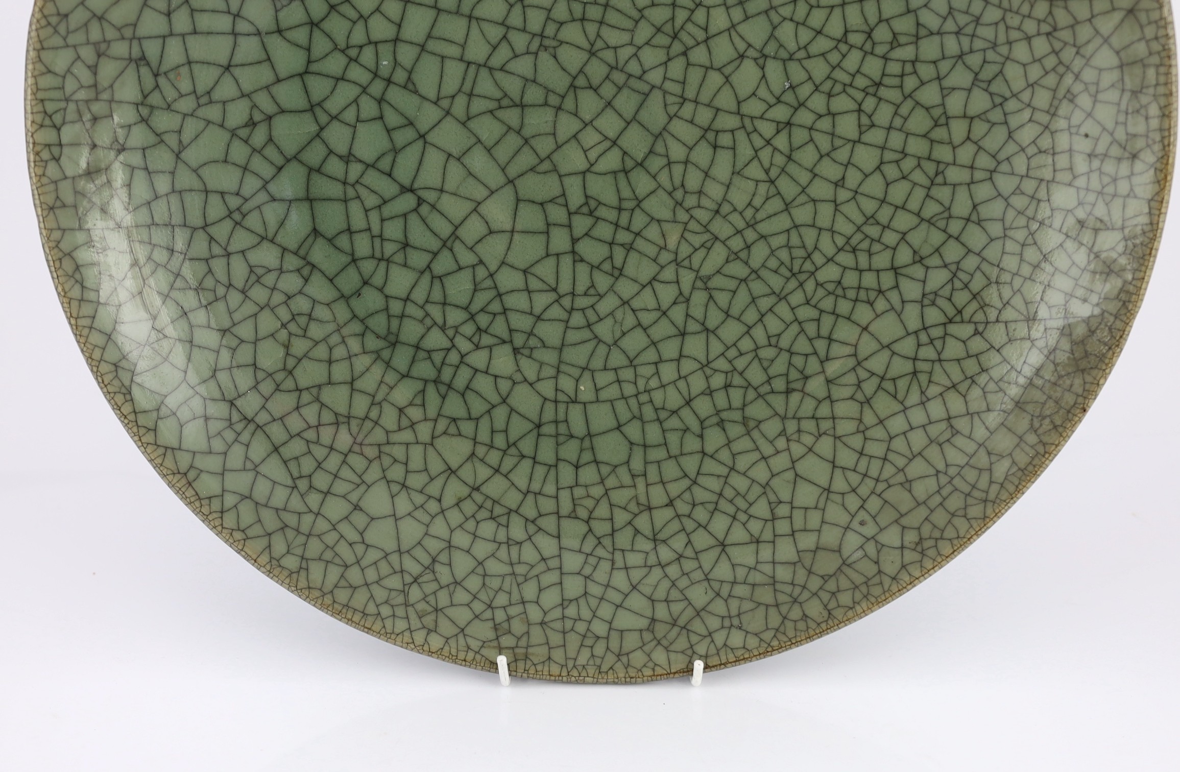 A large Chinese Guan type crackle glaze dish, 19th/20th century, 45.5cm diameter